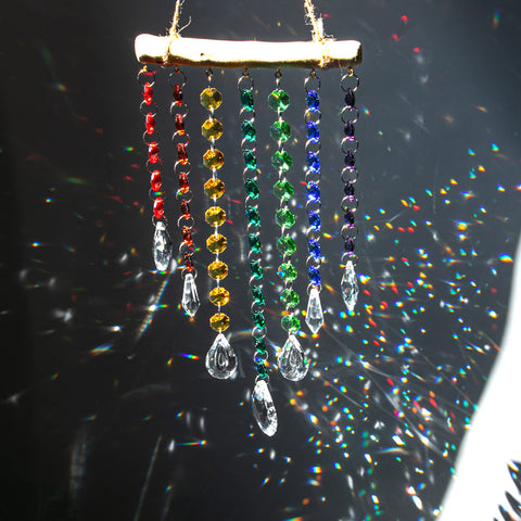 YU FENG chakra bead chain adds colorful sparkle to windows.