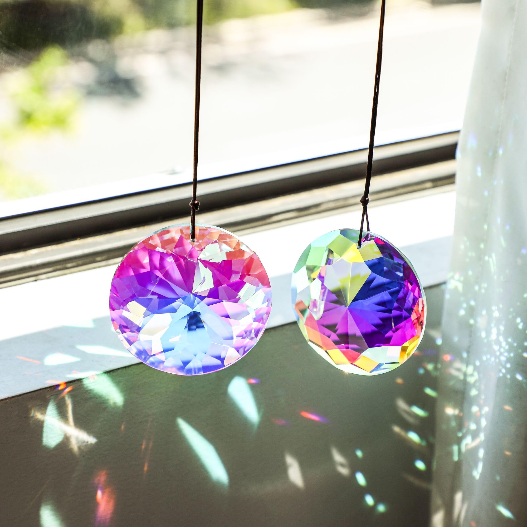 YU FENG convex window suncatcher catching light from multiple angles