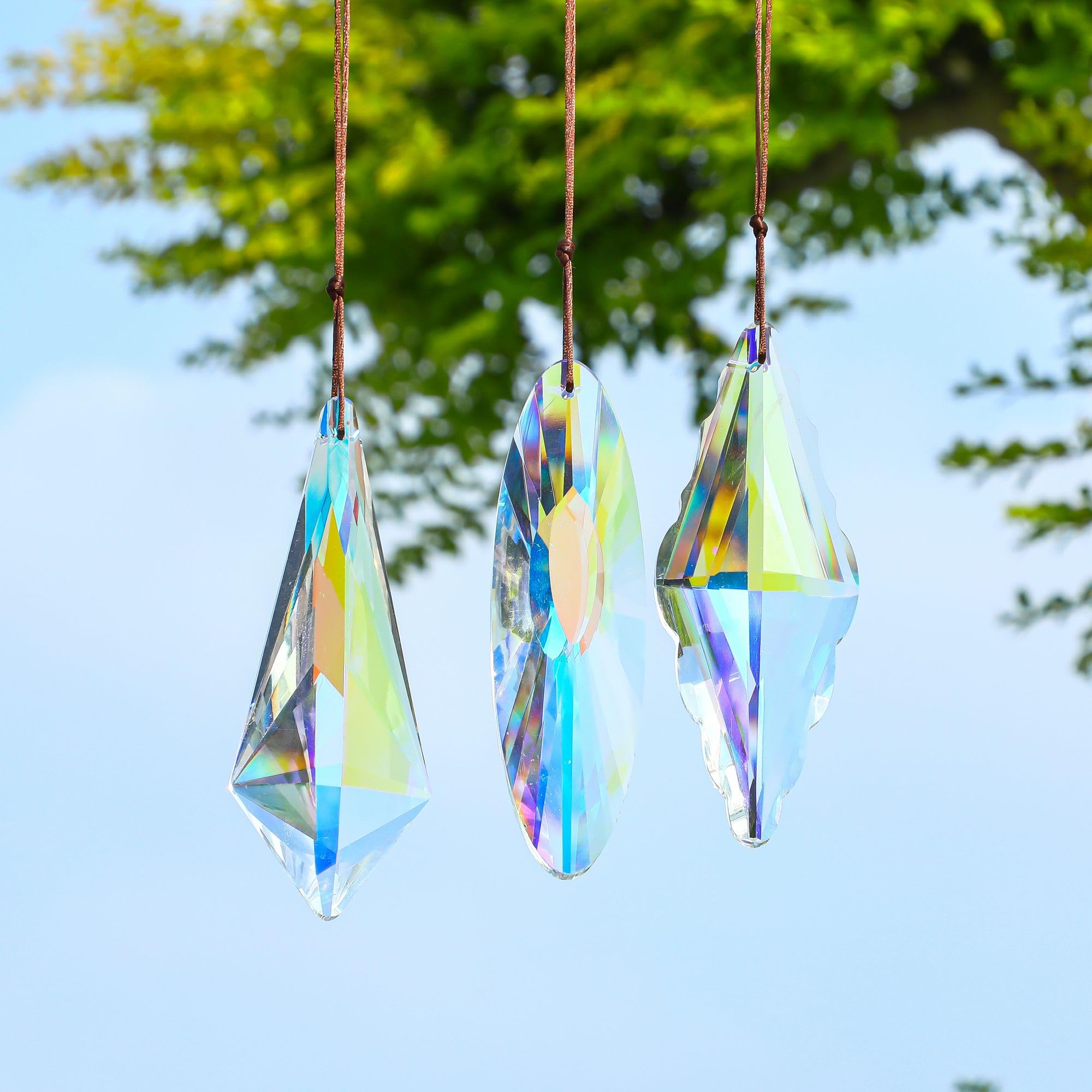 YU FENG AB-color prism suncatcher on a chandelier adds sparkling ambience
