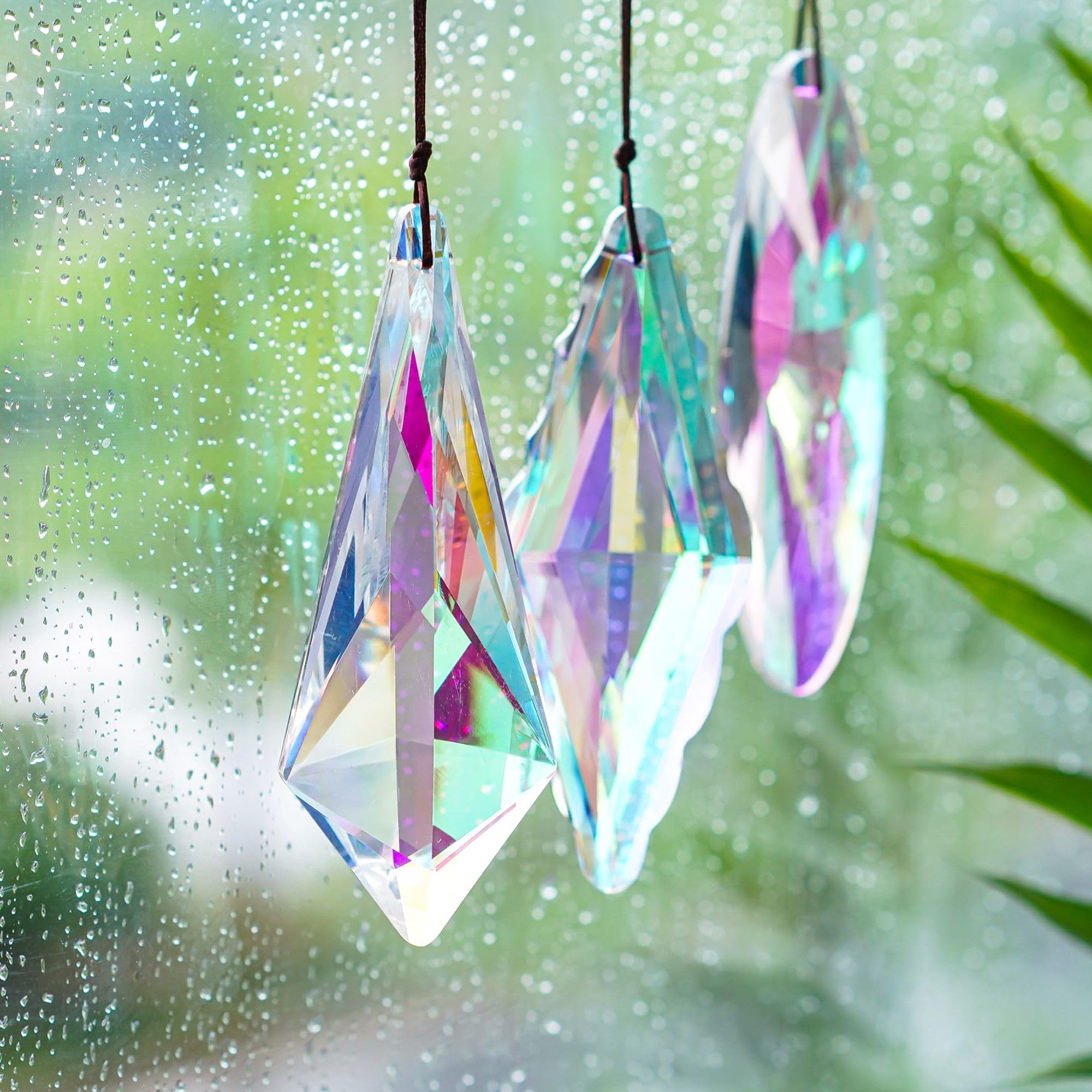 YU FENG crystal prism suncatcher near a window displays shifting rainbows