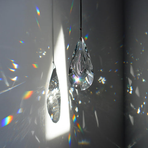YU FENG rainbow display by window, ideal for brightening living spaces.