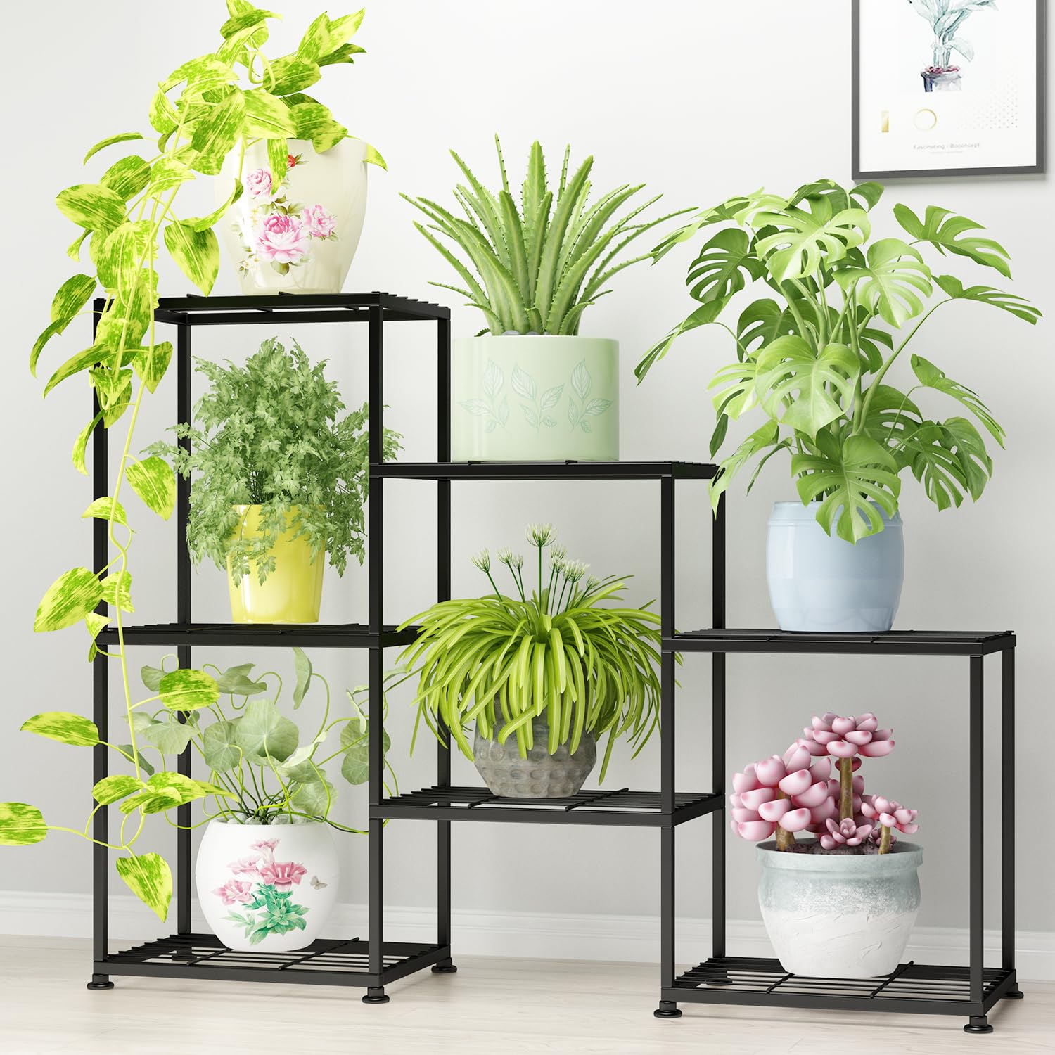 YUJCHMTZN three-tier metal plant stand displaying multiple pots in a living room.