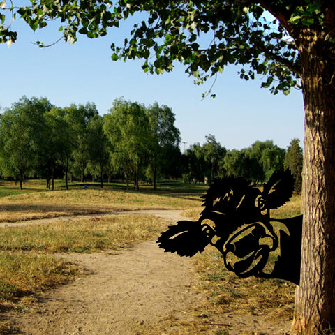 Peeping cow design casts playful shadows along pathways.