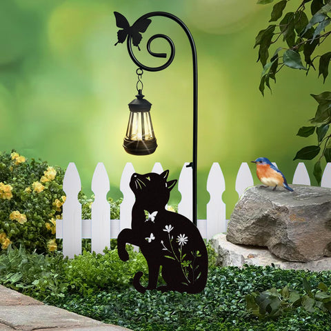 YY Gardenia cat stake with solar light, front view illuminating a garden path.