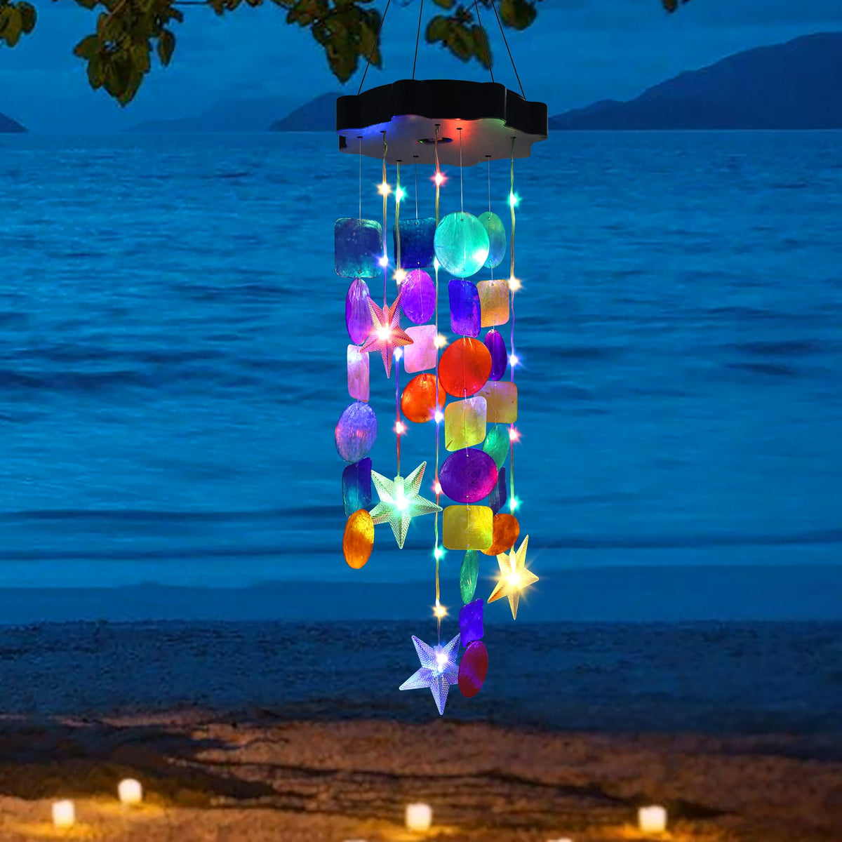 Zeiliuled Solar Shell Wind Chimes glow in garden at night for outdoor charm.