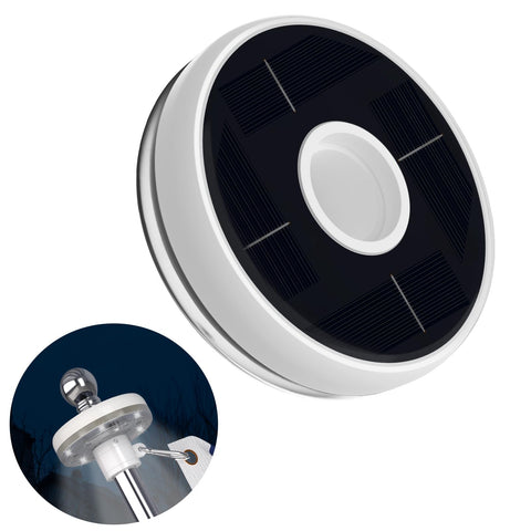 ZMTECH solar light mounted on a flag pole for night visibility.