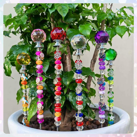 ZSlactp fairy garden stakes on display in a garden setting