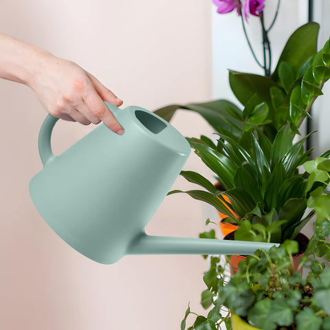 Compact light green ZXJ watering can fits on shelves and balconies.